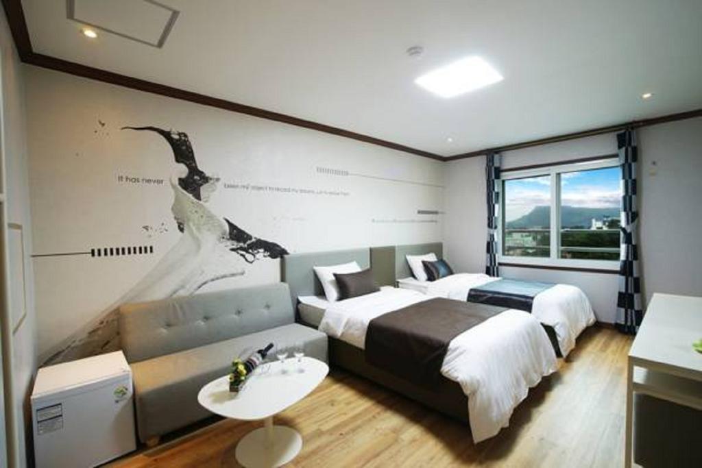 Seongsan Aqua Beach Hotel Seogwipo Værelse billede